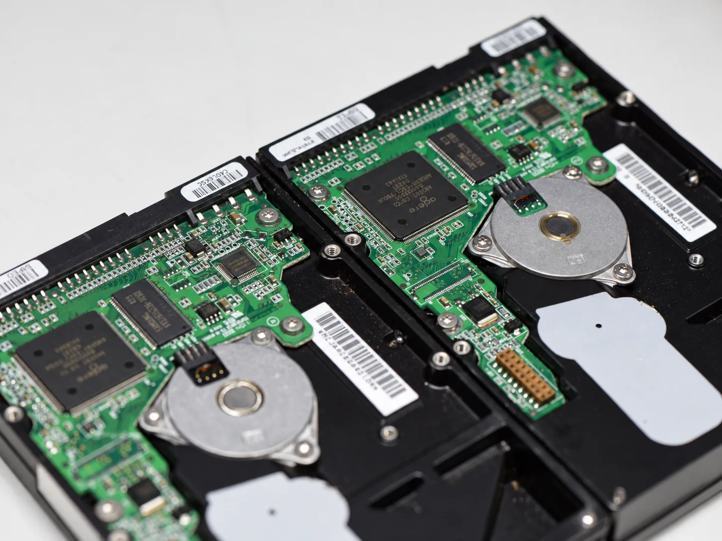 Two legacy Maxtor hard drives showing PCB assemblies used for donor board comparison