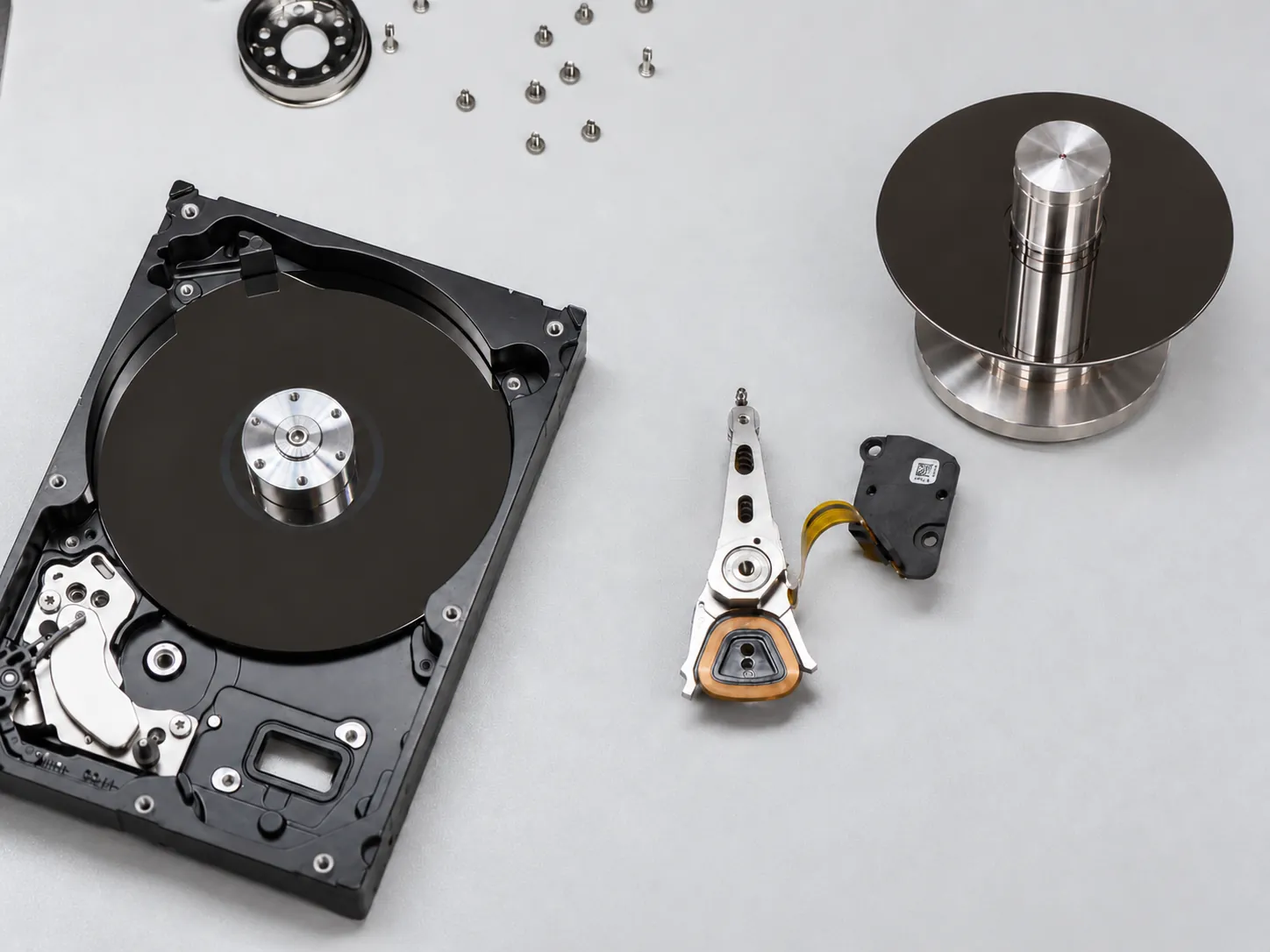 Hard drive platters being evaluated one recording surface at a time after a previous recovery attempt