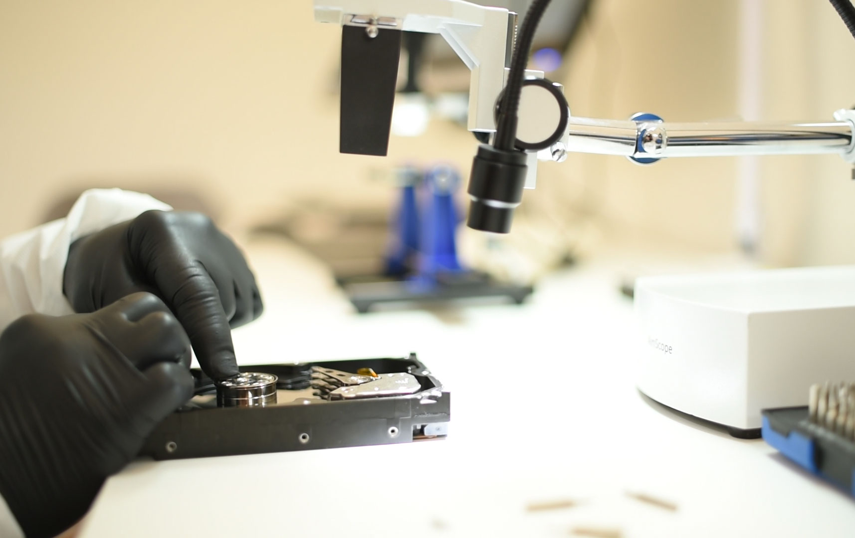 Data recovery technician working on storage media at Aesonlabs