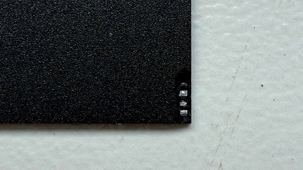 Failed capacitors on a monolithic SD card identified during data recovery diagnostics