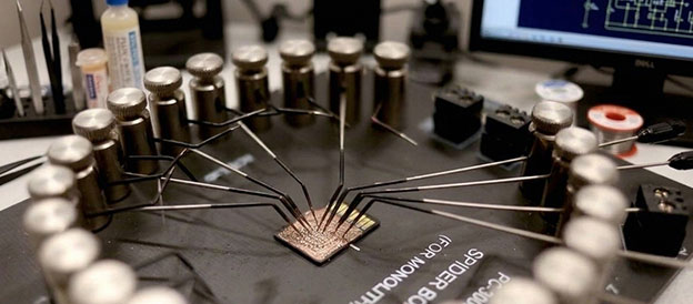 Monolithic microSD card wired to NAND pinout test points for data recovery