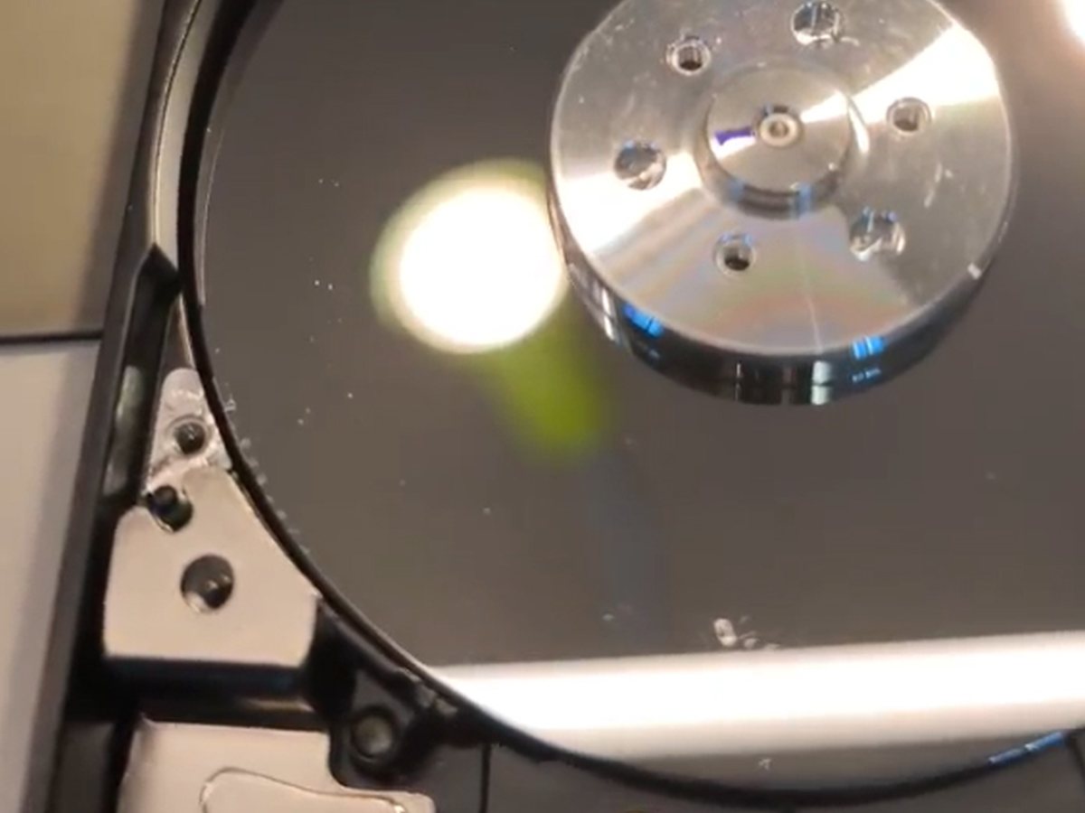 Close view of tiny physical defects on hard-drive recording surface 0