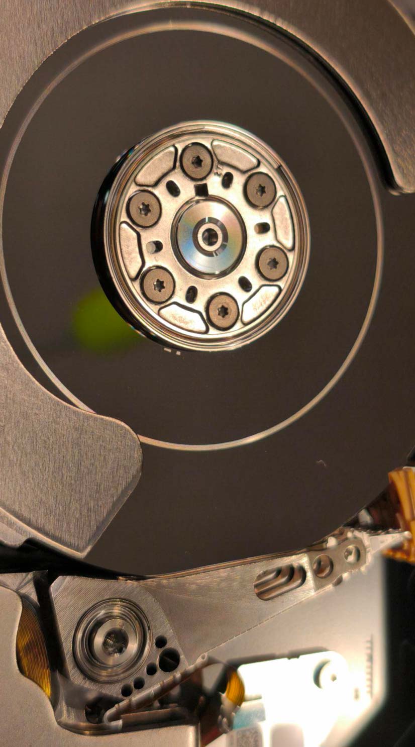 Head crash and platter damage inside a dropped hard drive