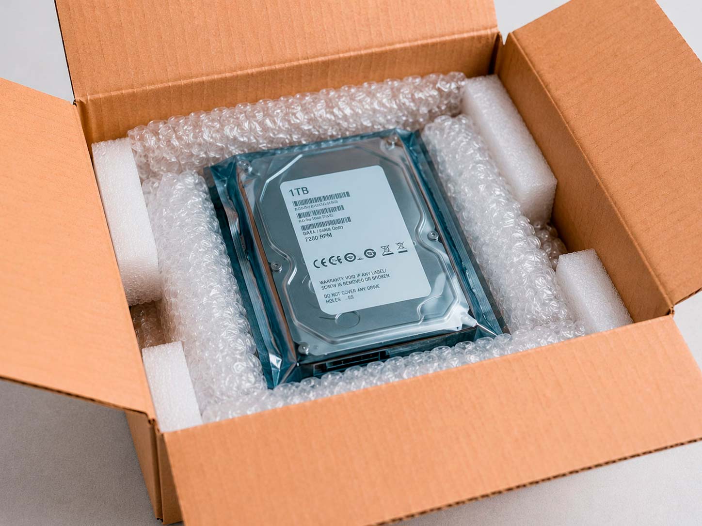 Hard drive safely packaged in anti-static protection and cushioning for shipping
